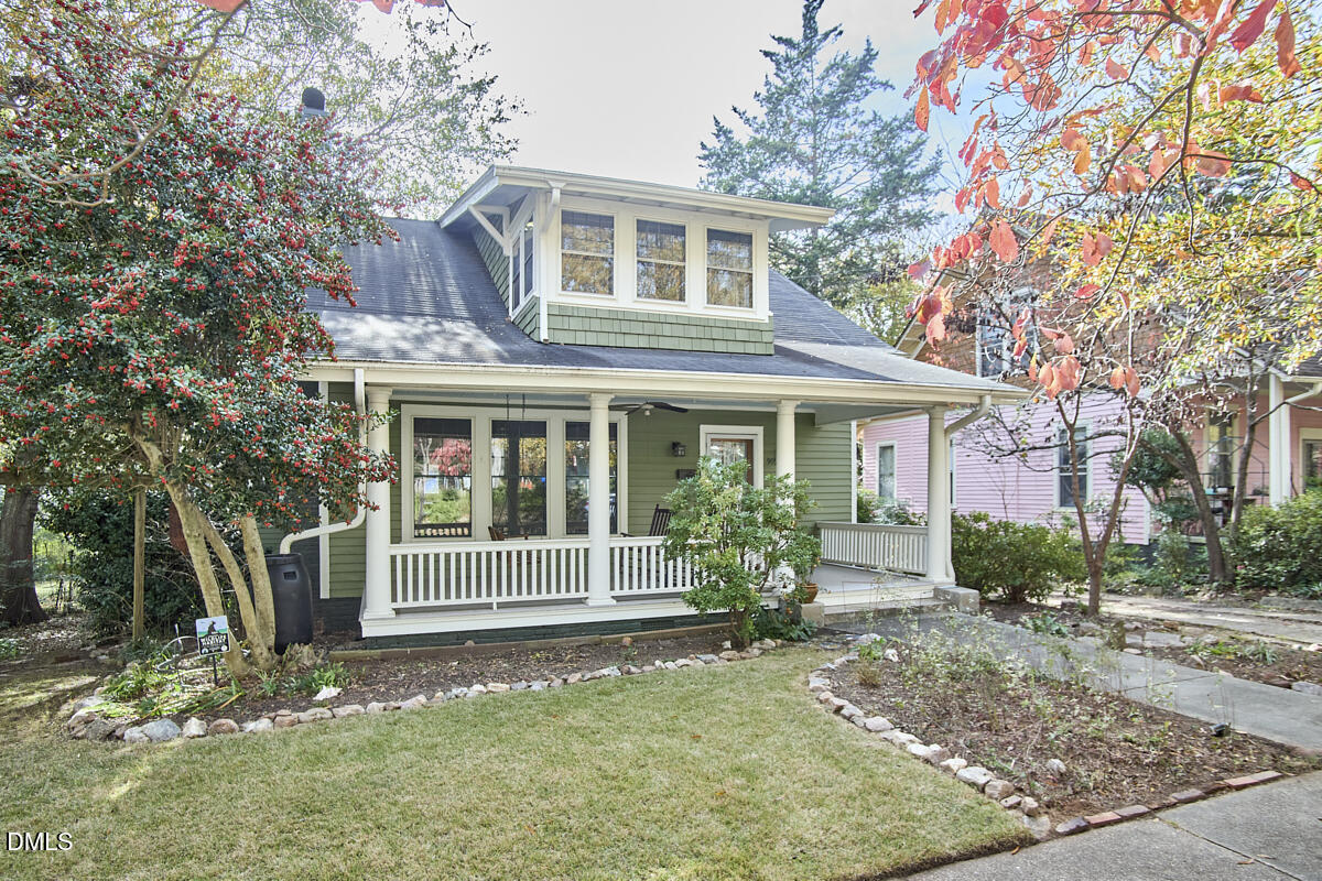 909 West Lenoir Street Raleigh, NC 27603 - Photo 1 of 8 a front view of a house with a yard