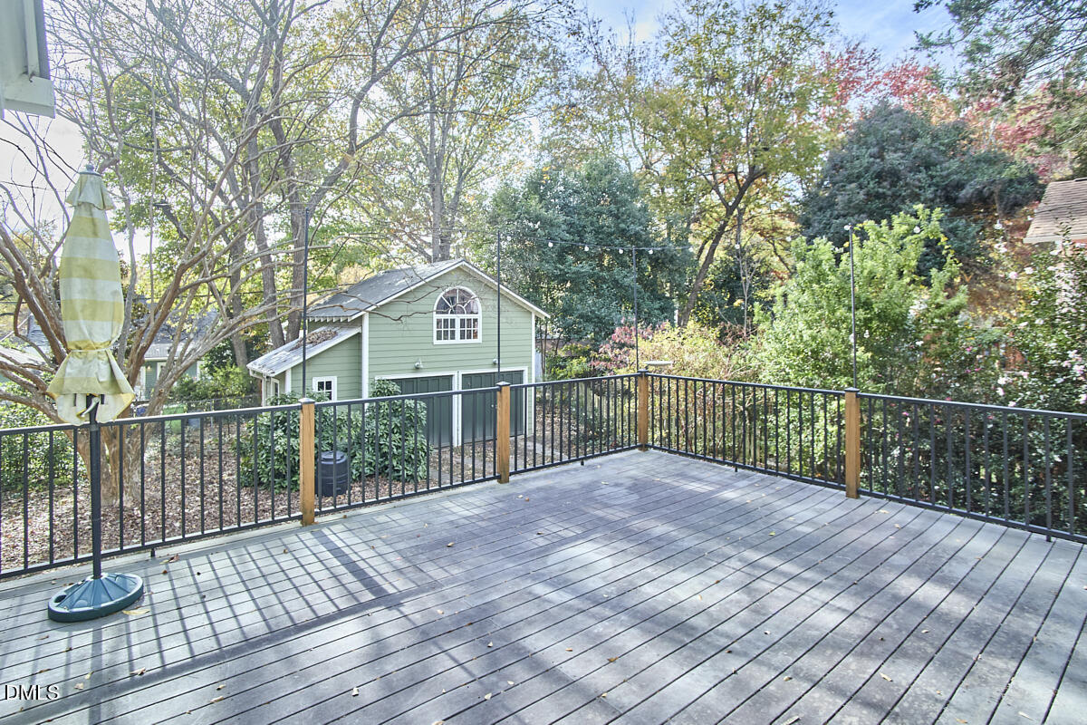 909 West Lenoir Street Raleigh, NC 27603 - Photo 6 of 8 a view of a deck with a large window and wooden floor