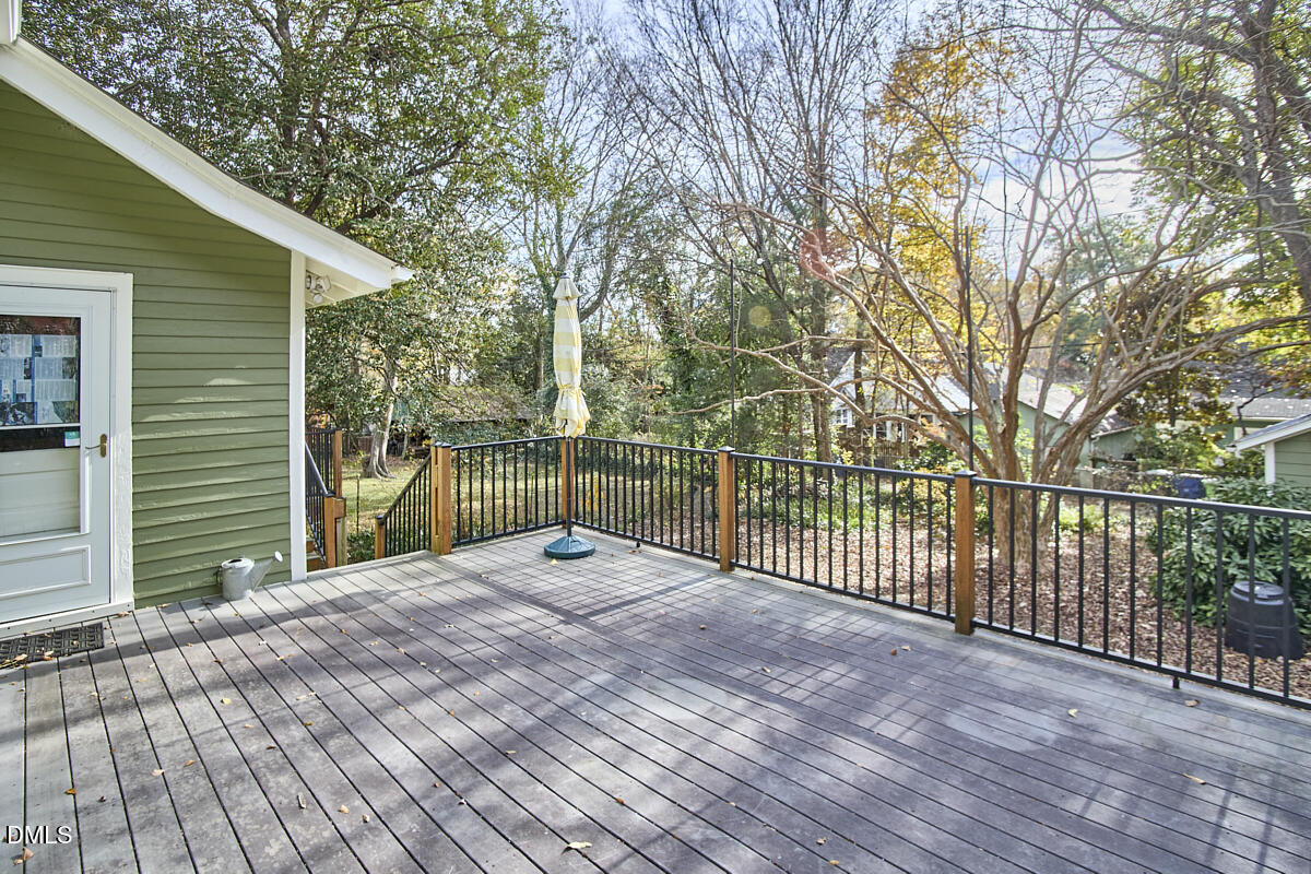 909 West Lenoir Street Raleigh, NC 27603 - Photo 7 of 8 a view of a backyard with a large tree