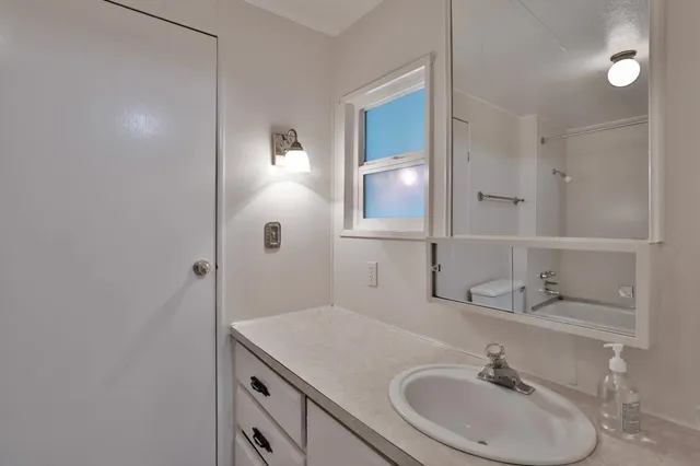 a bathroom with a shower and a toilet