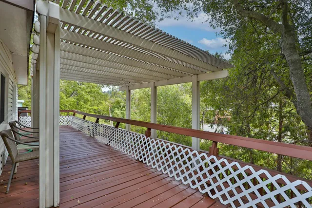a view of balcony with wooden floor
