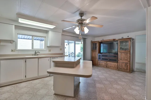 a kitchen with a sink and stove