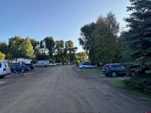 a view of street with parked cars