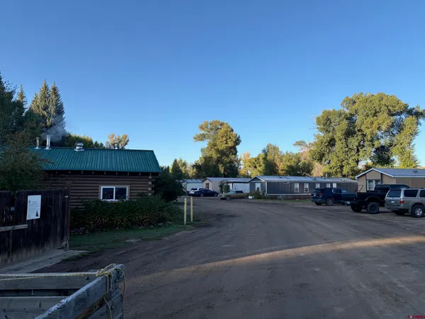 a view of street with parked cars