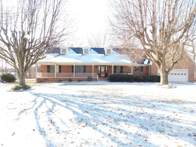 a front view of a building with a yard
