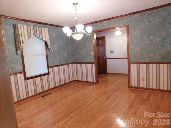 a view of a livingroom with wooden floor