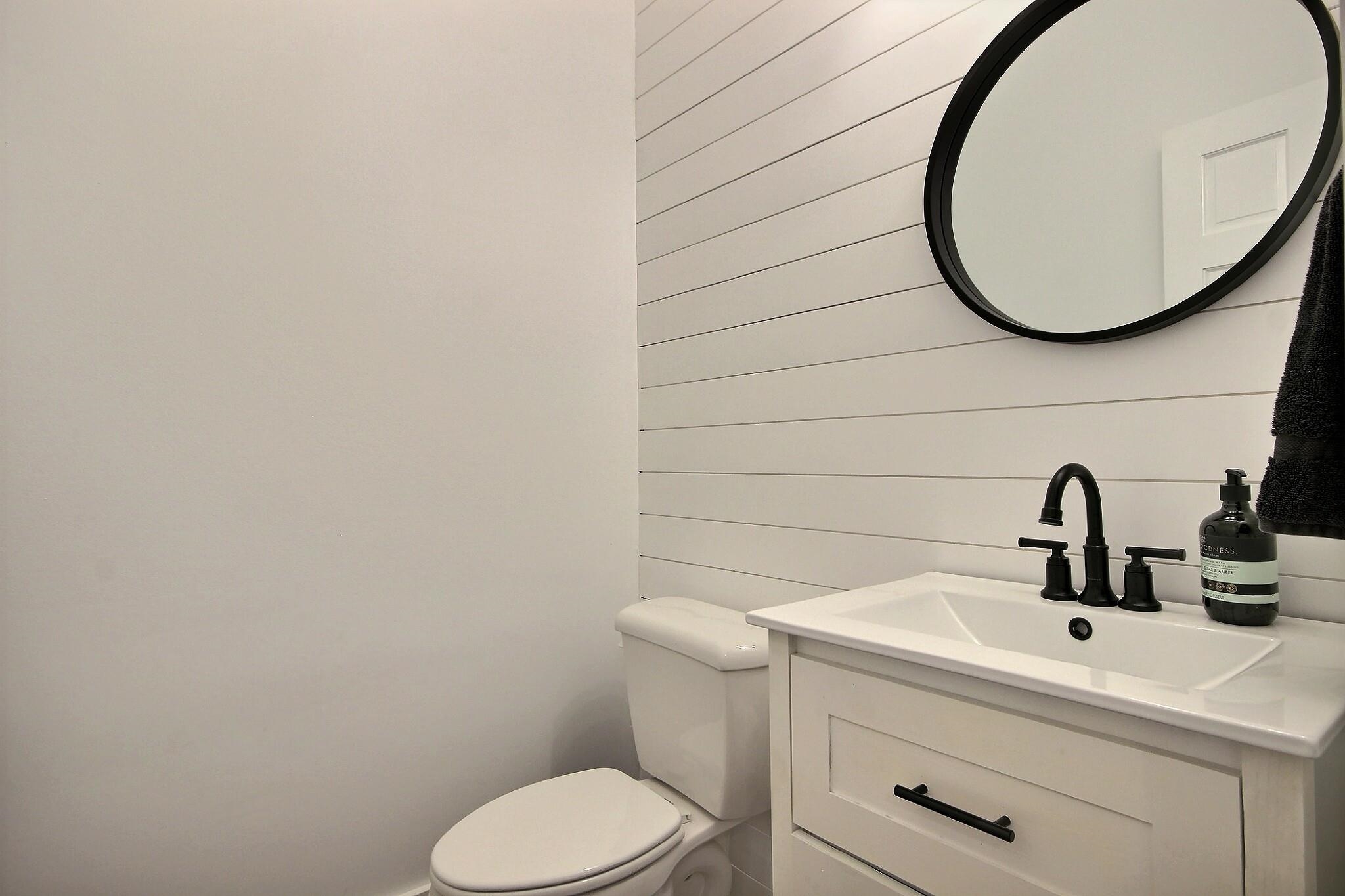 705 Cotham Drive Collierville, TN 38017 - Photo 12 of 25 a bathroom with a toilet sink and mirror