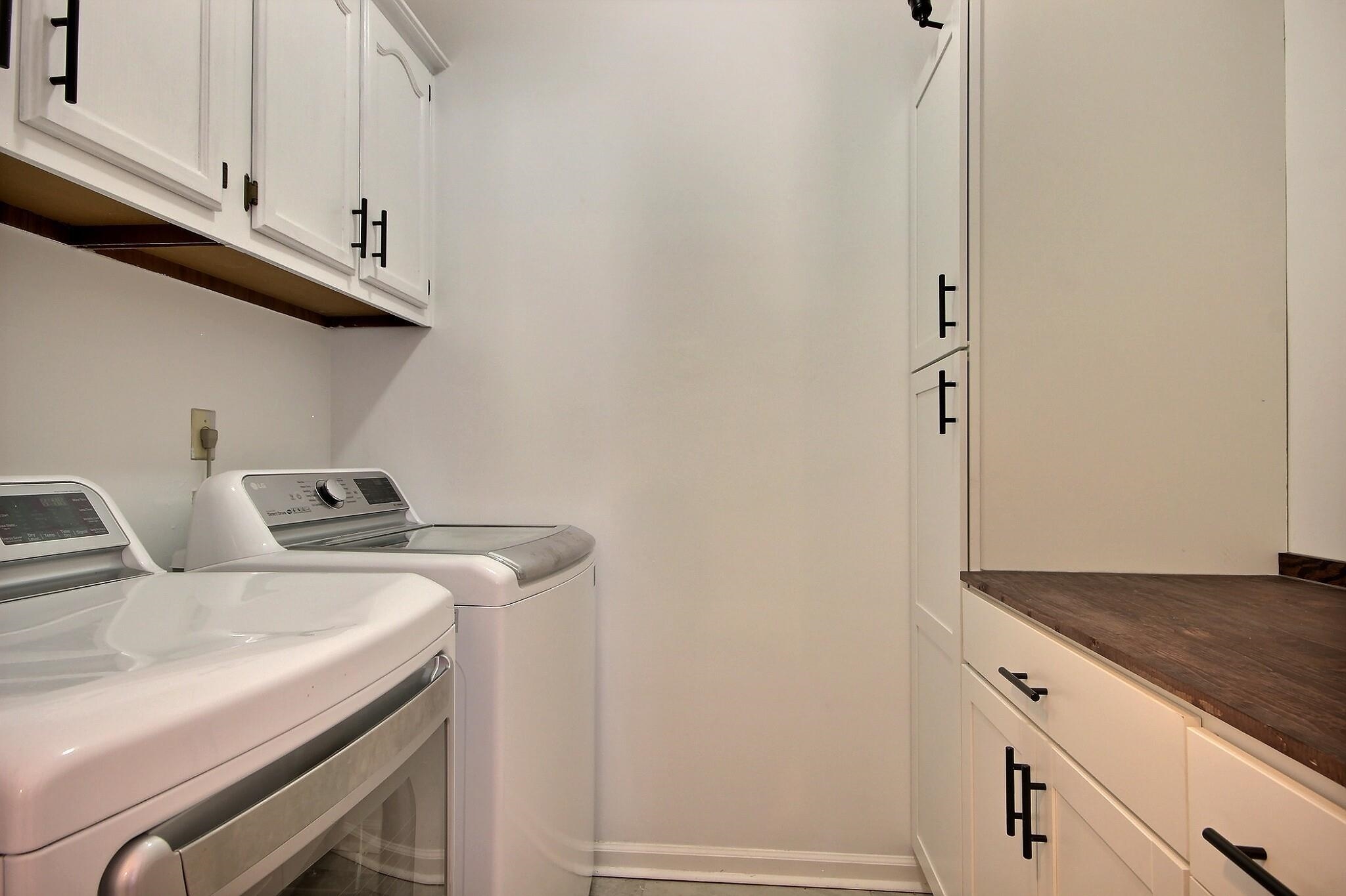 705 Cotham Drive Collierville, TN 38017 - Photo 13 of 25 a view of storage and utility room with washer and dryer