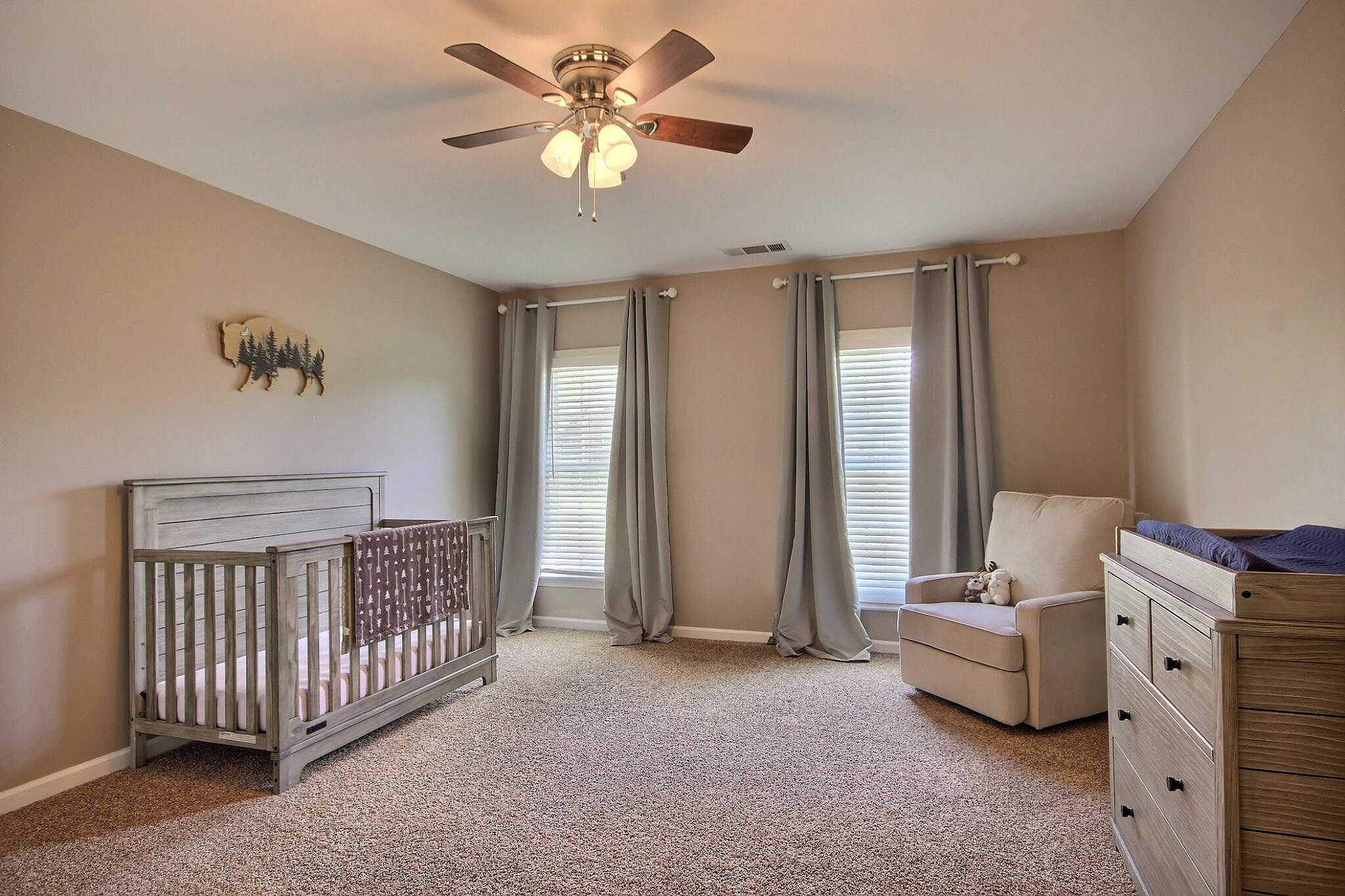 705 Cotham Drive Collierville, TN 38017 - Photo 17 of 25 a living room with furniture and a chandelier