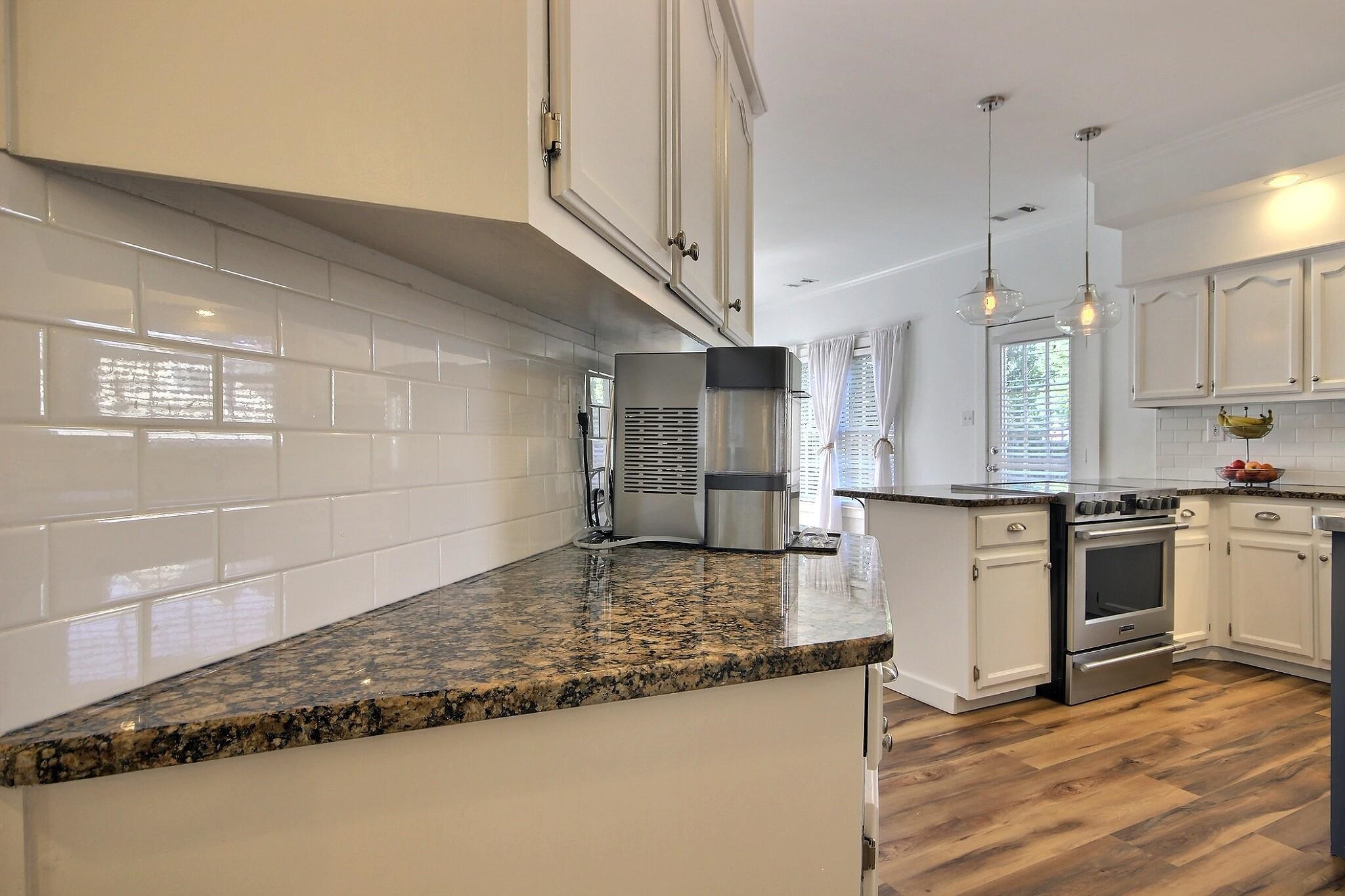 705 Cotham Drive Collierville, TN 38017 - Photo 4 of 25 a kitchen with stainless steel appliances granite countertop a sink stove and refrigerator