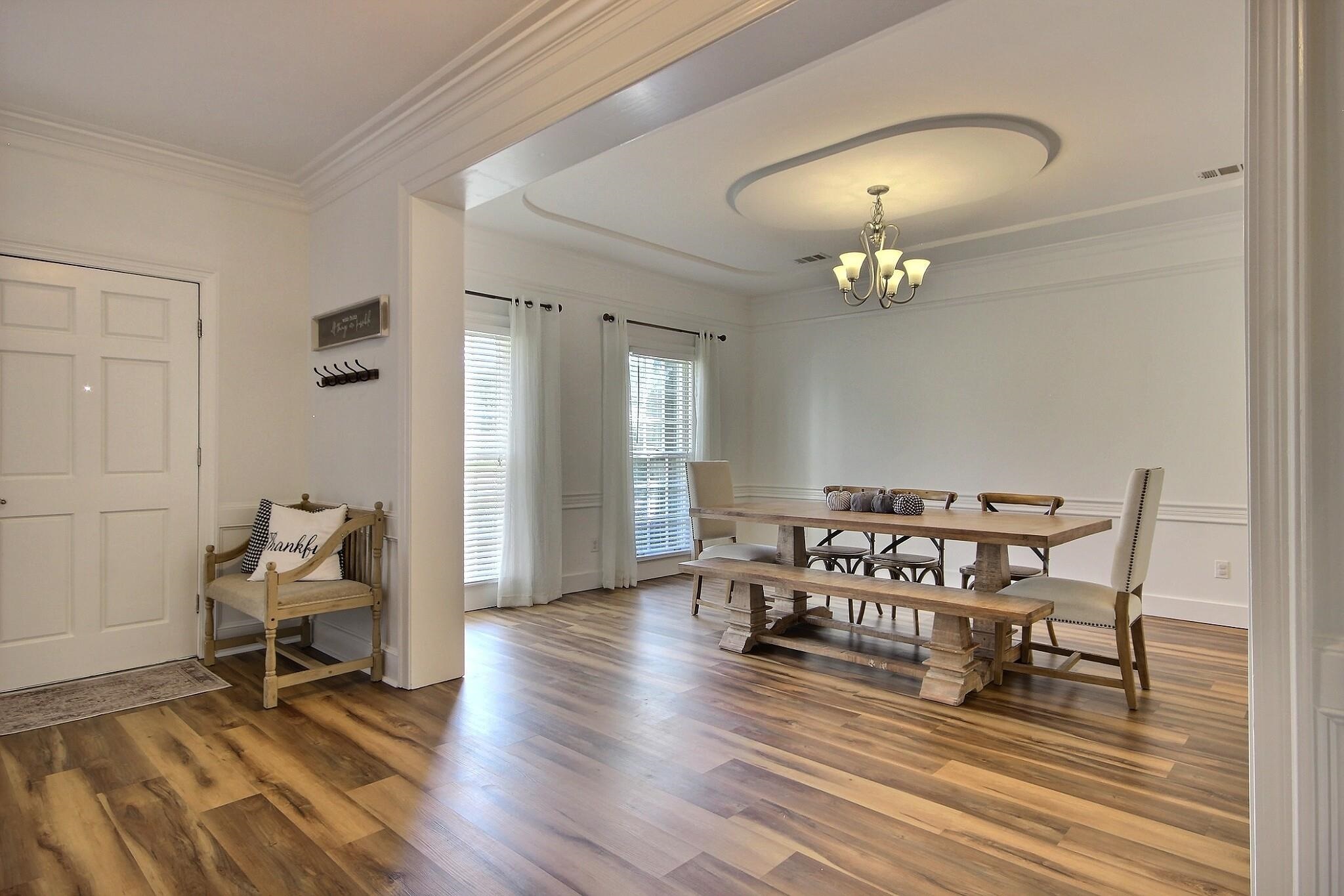 705 Cotham Drive Collierville, TN 38017 - Photo 7 of 25 a living room with furniture and a chandelier