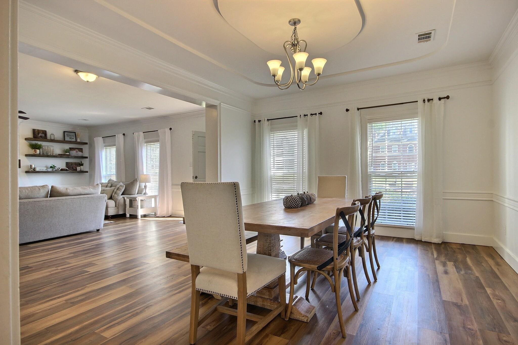 705 Cotham Drive Collierville, TN 38017 - Photo 8 of 25 a view of a dining room with furniture and wooden floor