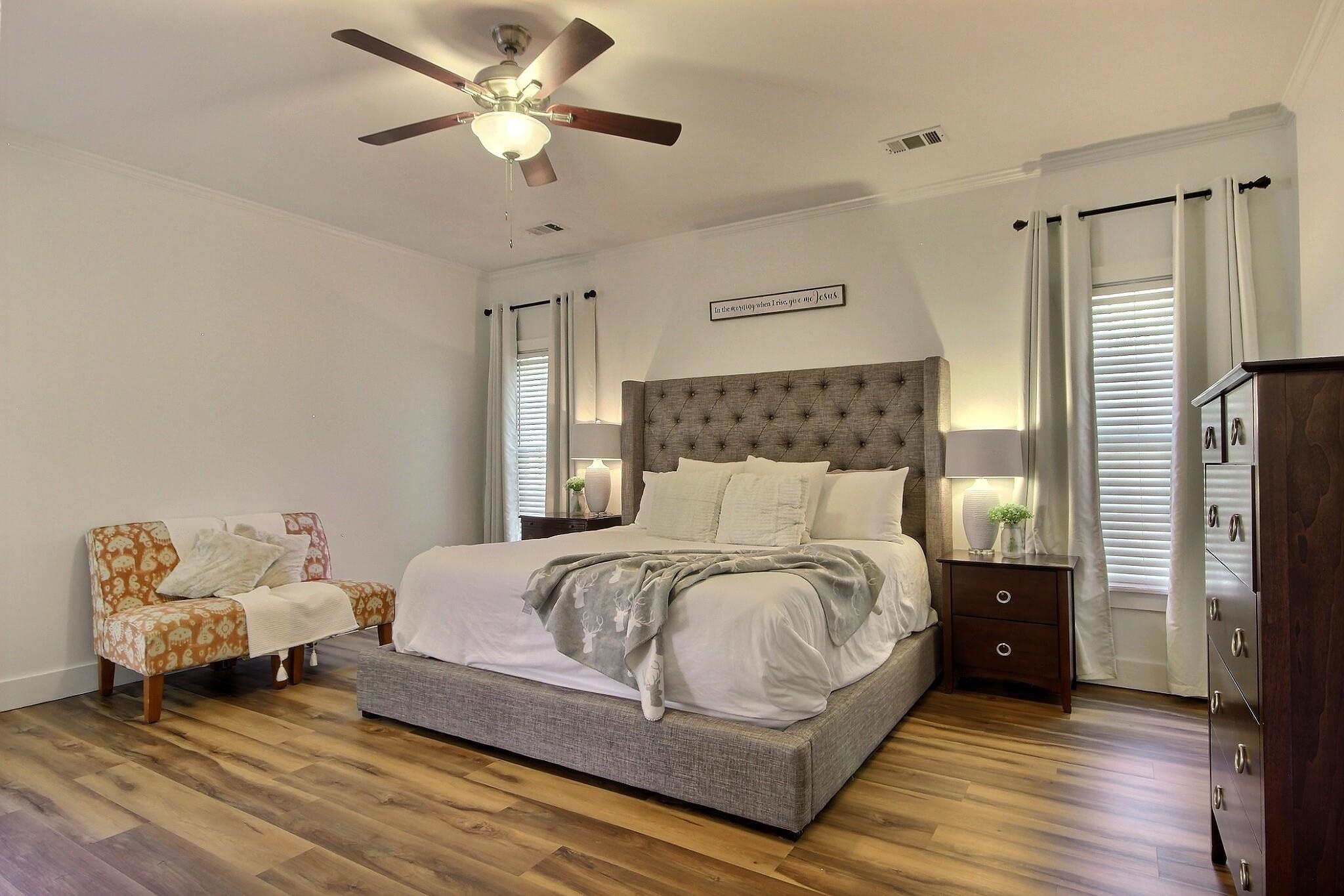 705 Cotham Drive Collierville, TN 38017 - Photo 9 of 25 a bedroom with a bed and a chandelier