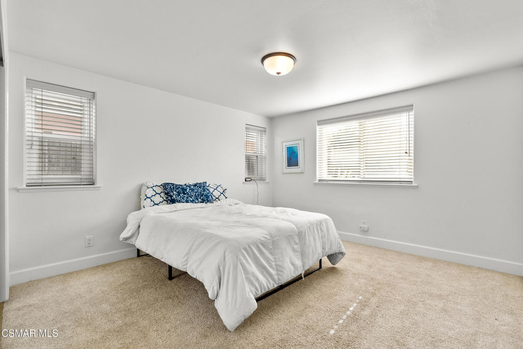 5138 Outrigger Way, Unit 1 Oxnard, CA 93035 - Photo 13 of 20 a bedroom with a bed and a window