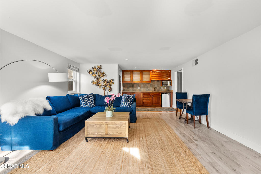 5138 Outrigger Way, Unit 1 Oxnard, CA 93035 - Photo 2 of 20 a living room with furniture and a wooden floor