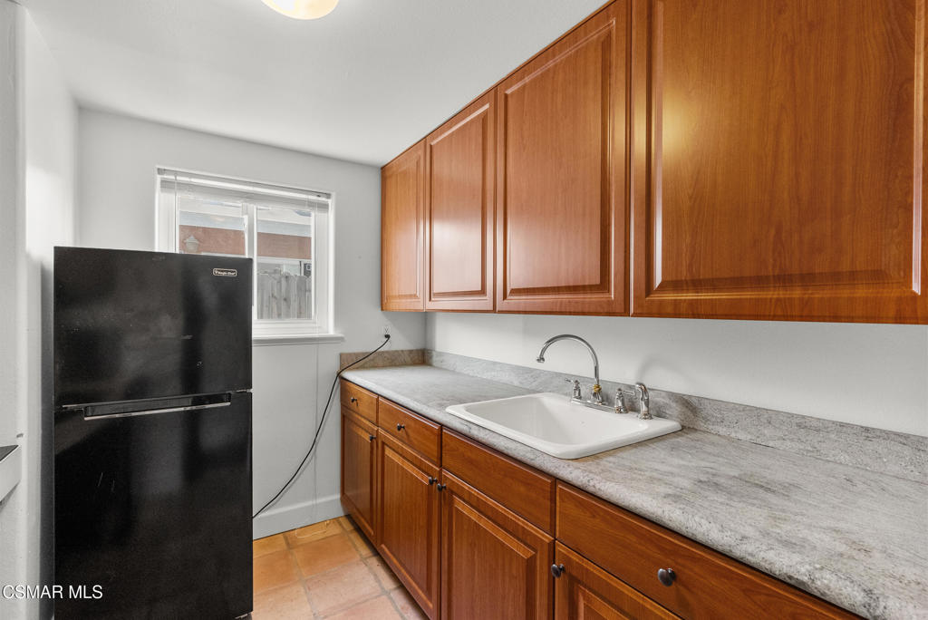 5138 Outrigger Way, Unit 1 Oxnard, CA 93035 - Photo 7 of 20 a kitchen with a sink and a refrigerator