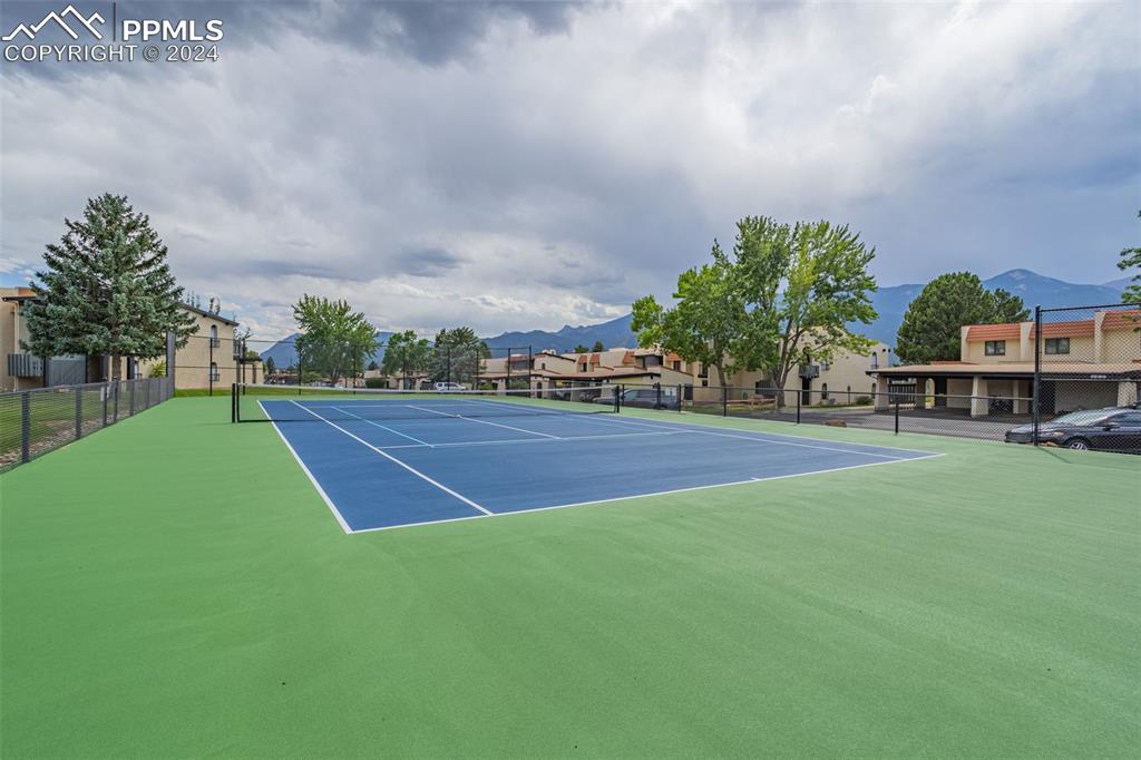 1098 Fontmore Road, Unit B Colorado Springs, CO 80904 - Photo 27 of 27 View of sport court with a mountain view and basketball court