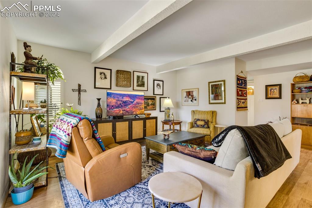 1098 Fontmore Road, Unit B Colorado Springs, CO 80904 - Photo 4 of 27 Living room with light wood-type flooring and beam ceiling