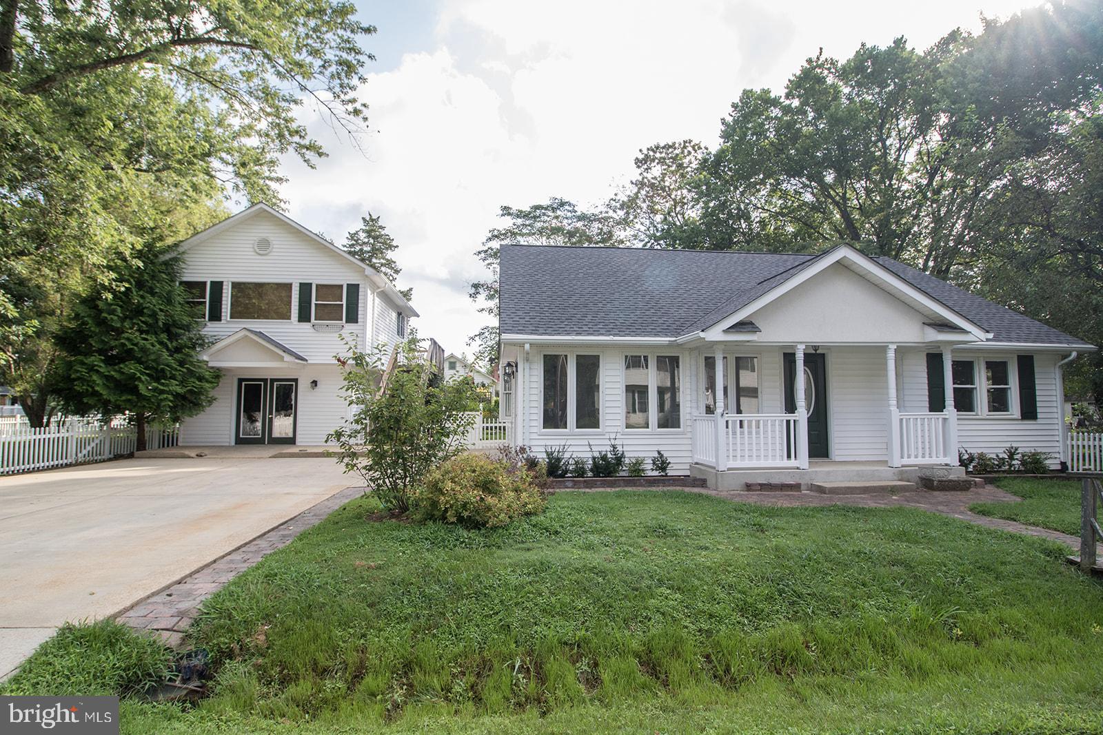 45044 Deagles Boatyard Road Tall Timbers, MD 20690 - Photo 1 of 64 a front view of house with yard and green space