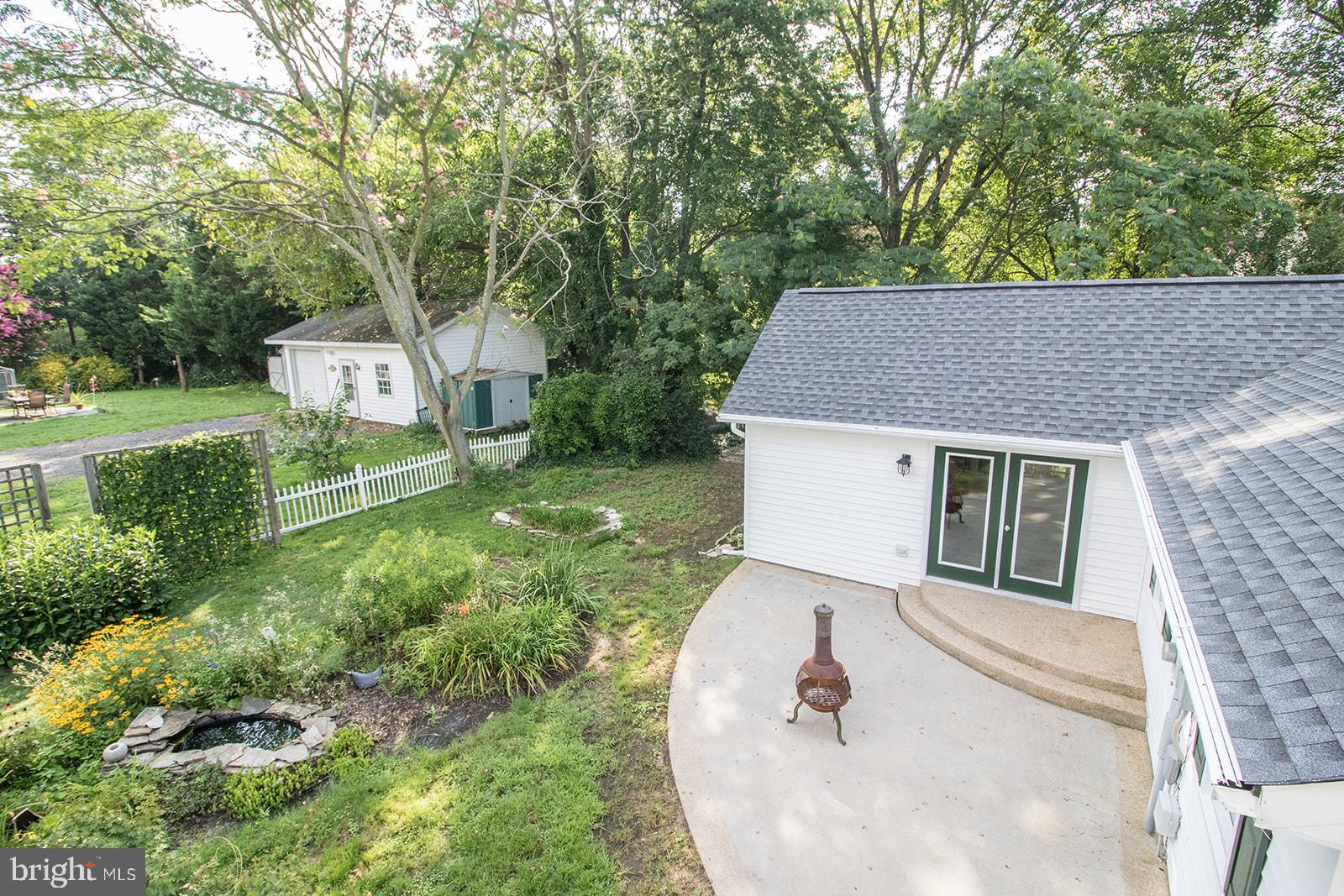 45044 Deagles Boatyard Road Tall Timbers, MD 20690 - Photo 11 of 64 a house view with a garden space