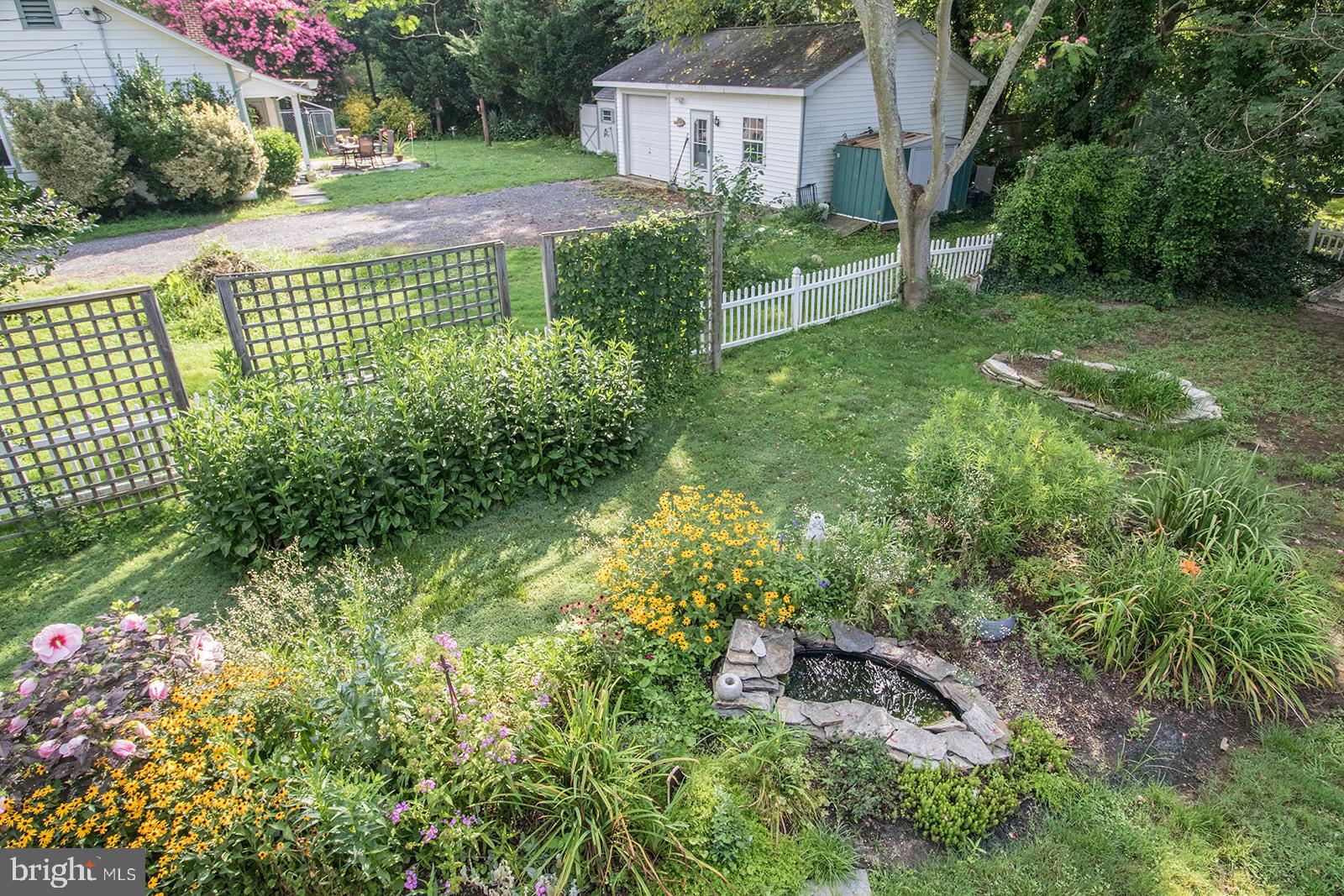 45044 Deagles Boatyard Road Tall Timbers, MD 20690 - Photo 12 of 64 a view of a garden in front of a house