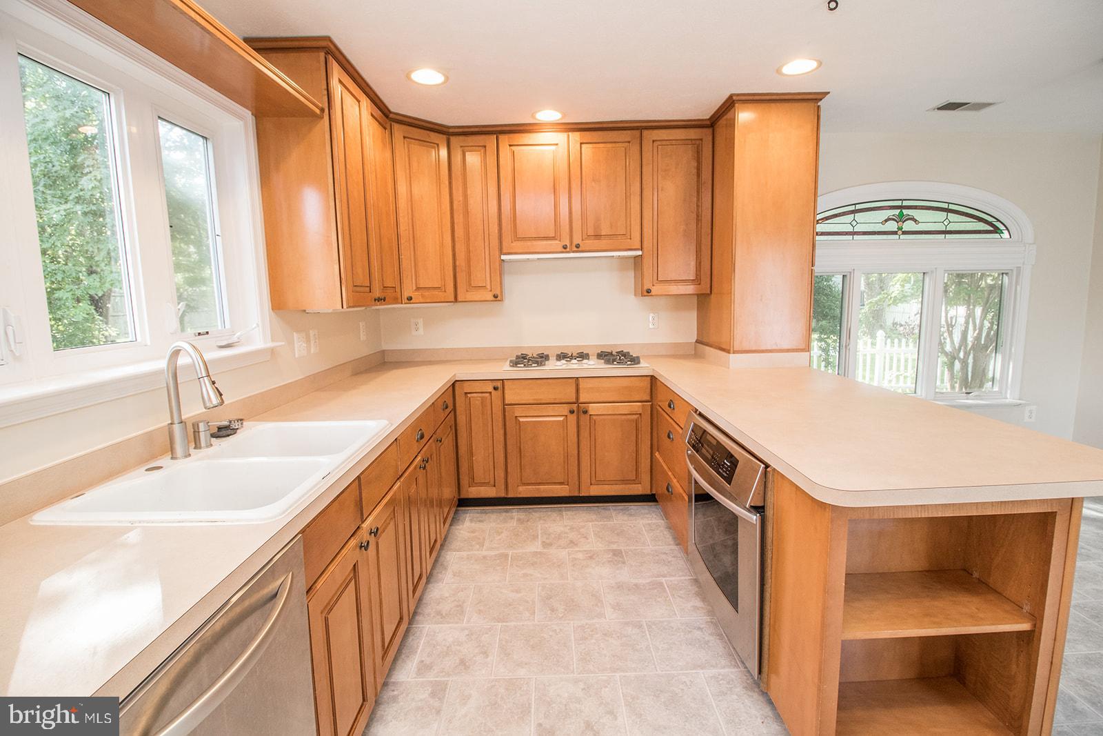 45044 Deagles Boatyard Road Tall Timbers, MD 20690 - Photo 31 of 64 a kitchen with a sink stove and cabinets