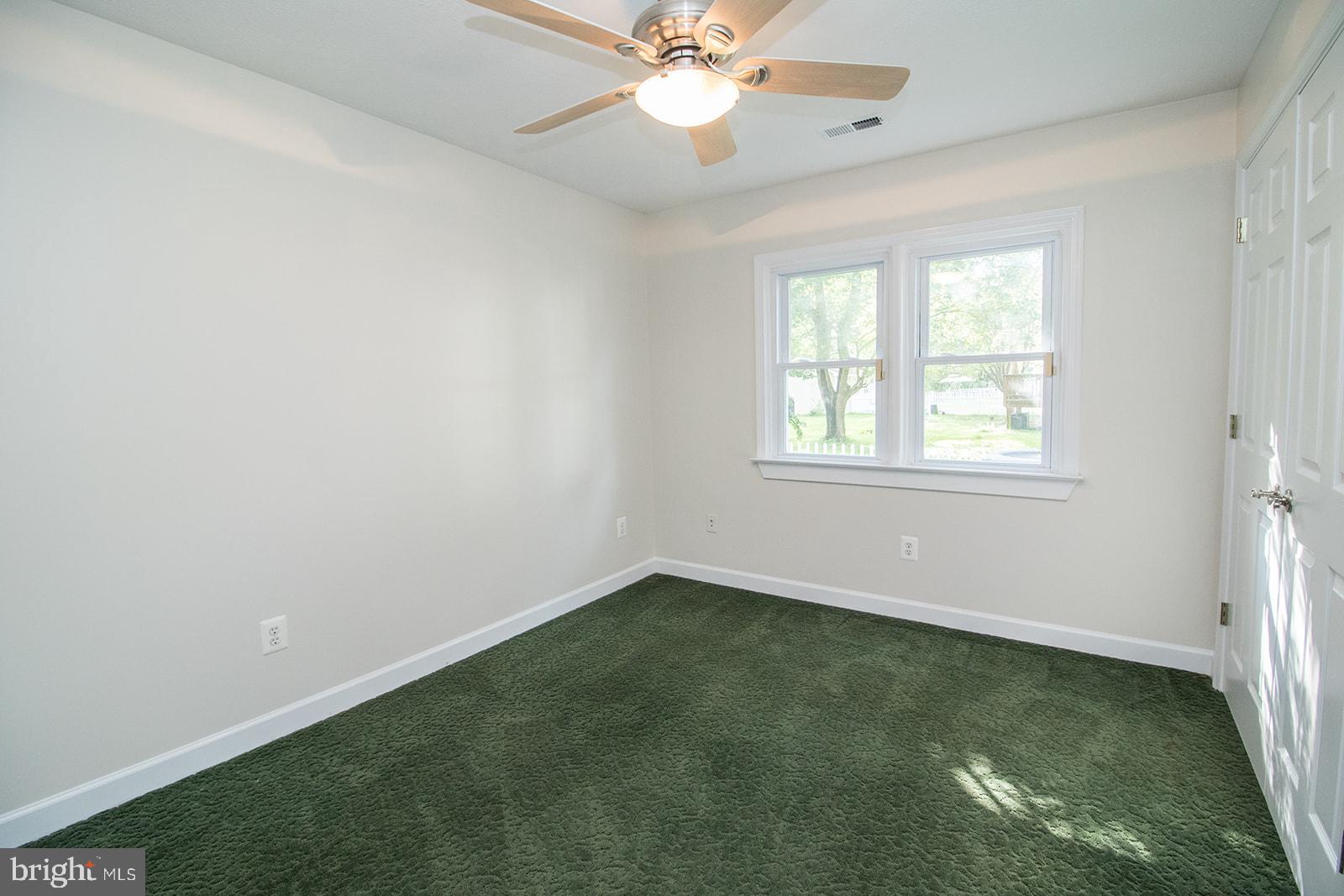 45044 Deagles Boatyard Road Tall Timbers, MD 20690 - Photo 37 of 64 an empty room with a window and a fan