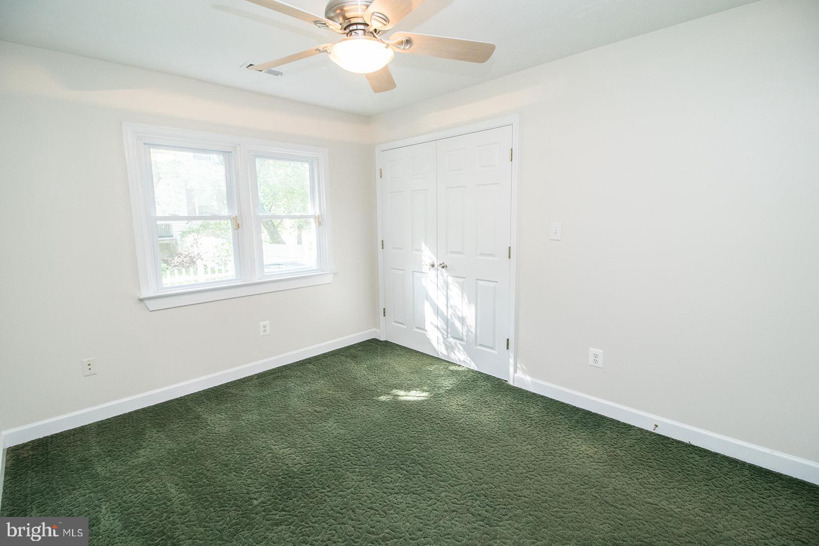 45044 Deagles Boatyard Road Tall Timbers, MD 20690 - Photo 38 of 64 an empty room with a window and a fan