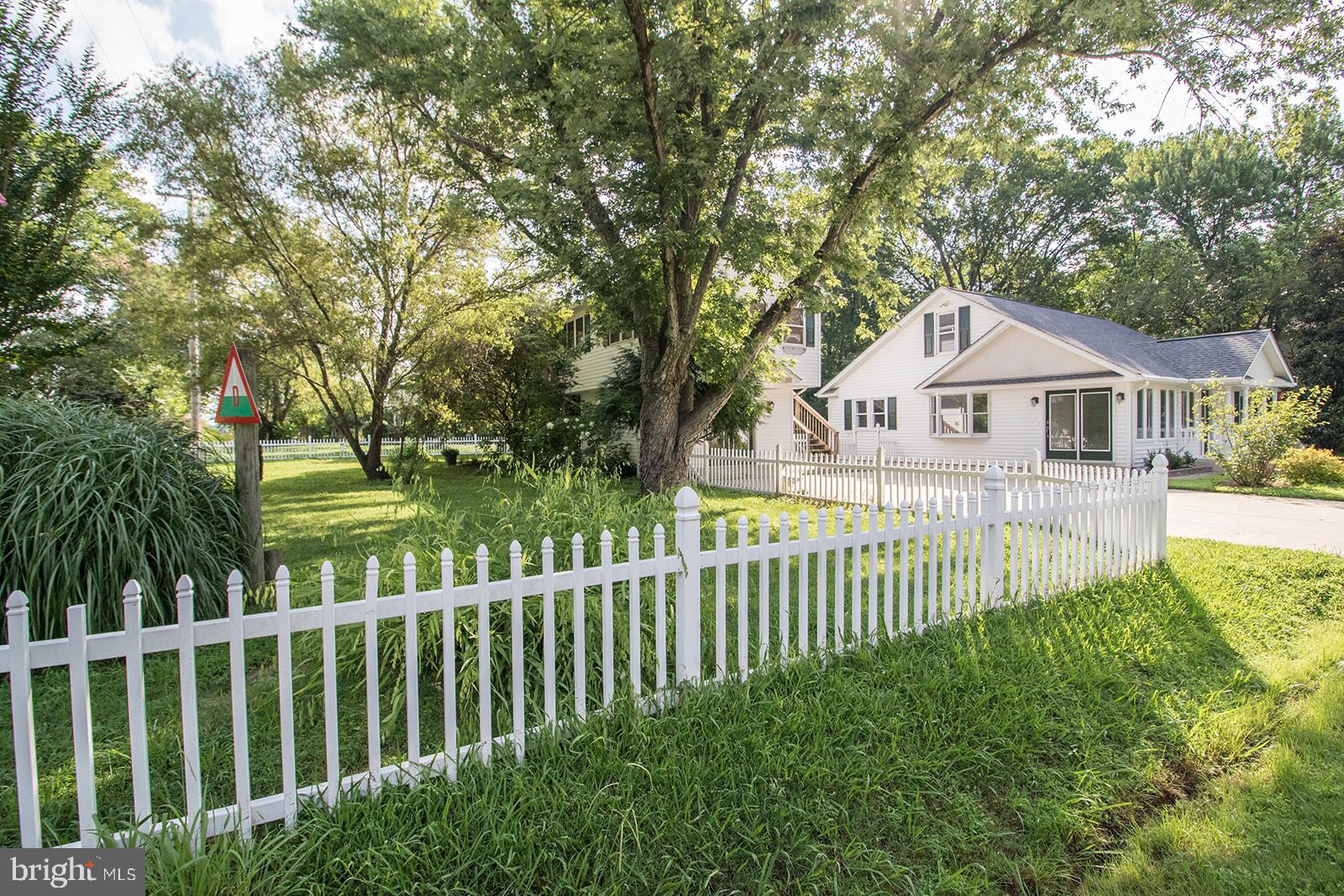 45044 Deagles Boatyard Road Tall Timbers, MD 20690 - Photo 58 of 64 a front view of a house with a garden