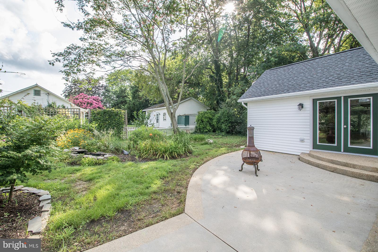 45044 Deagles Boatyard Road Tall Timbers, MD 20690 - Photo 10 of 64 a house with garden in front of it
