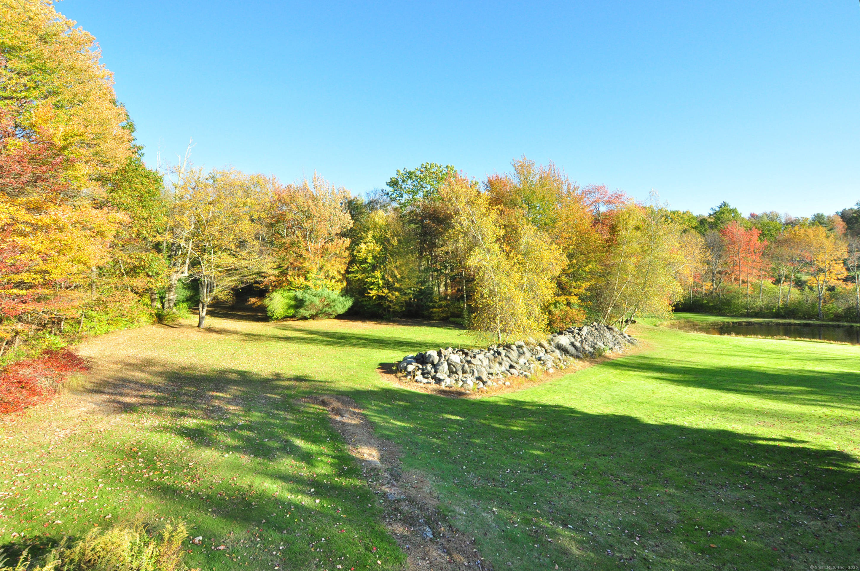86 Case Street Granby, CT 06090 - Photo 1 of 25 a view of yard with swimming pool and trees