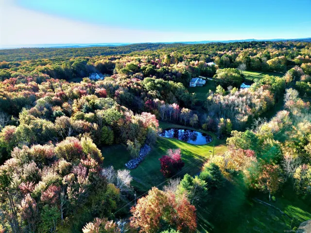 a view of a lake with houses in the background