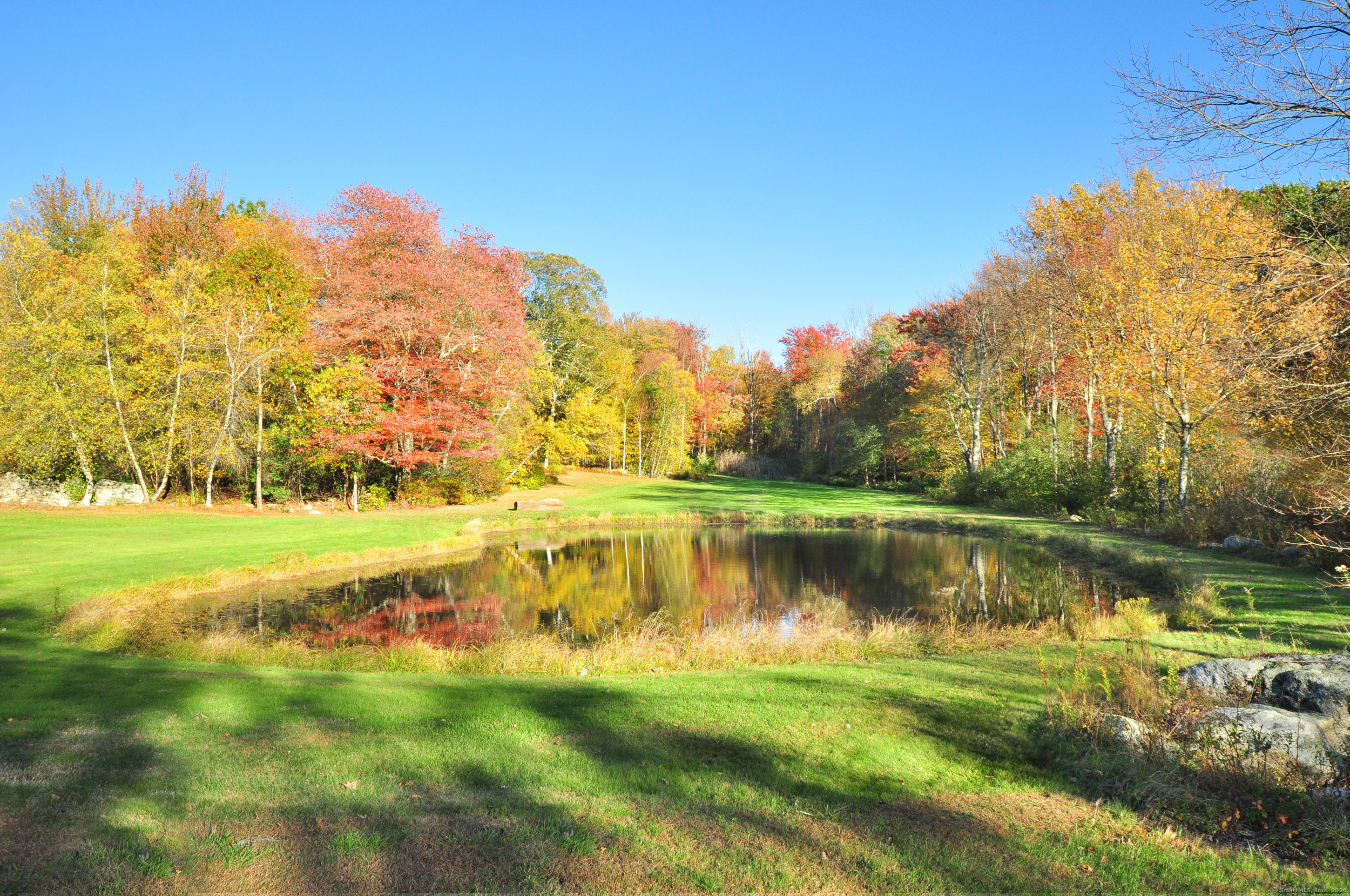 86 Case Street Granby, CT 06090 - Photo 22 of 25 a view of a lake with houses in the background