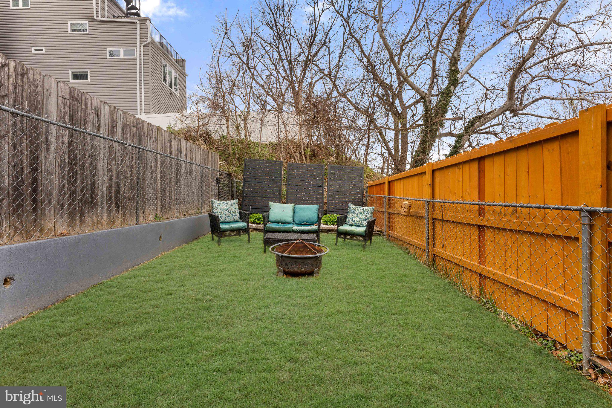 4823 Tibben Street Philadelphia, PA 19128 - Photo 15 of 28 a backyard of a house with barbeque oven