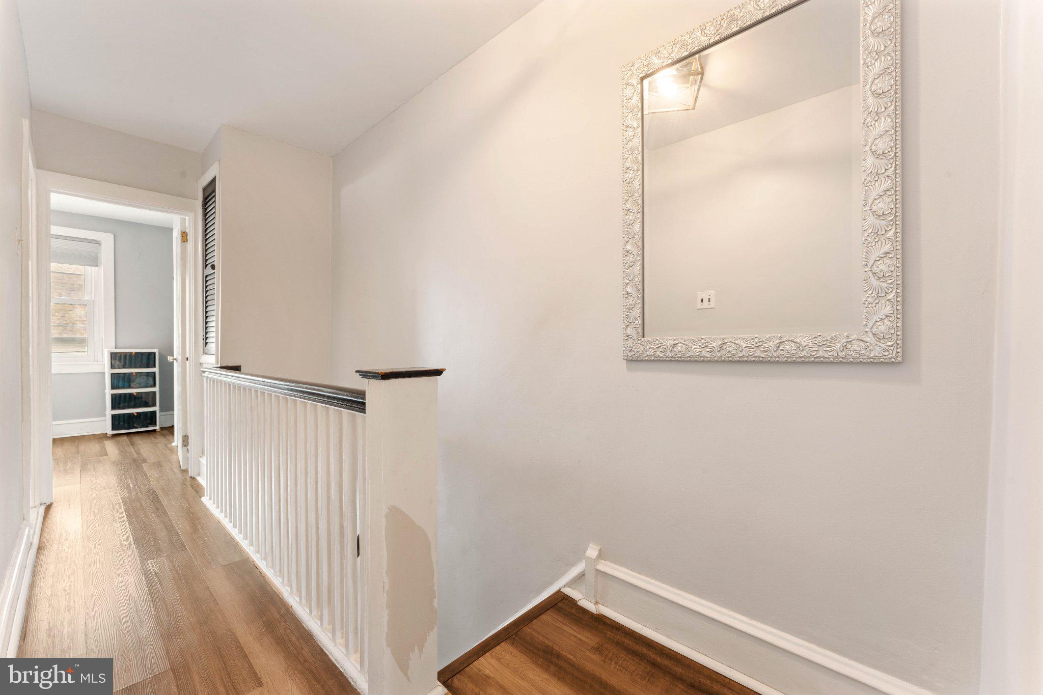 4823 Tibben Street Philadelphia, PA 19128 - Photo 17 of 28 a view of a hallway with wooden floor and entryway