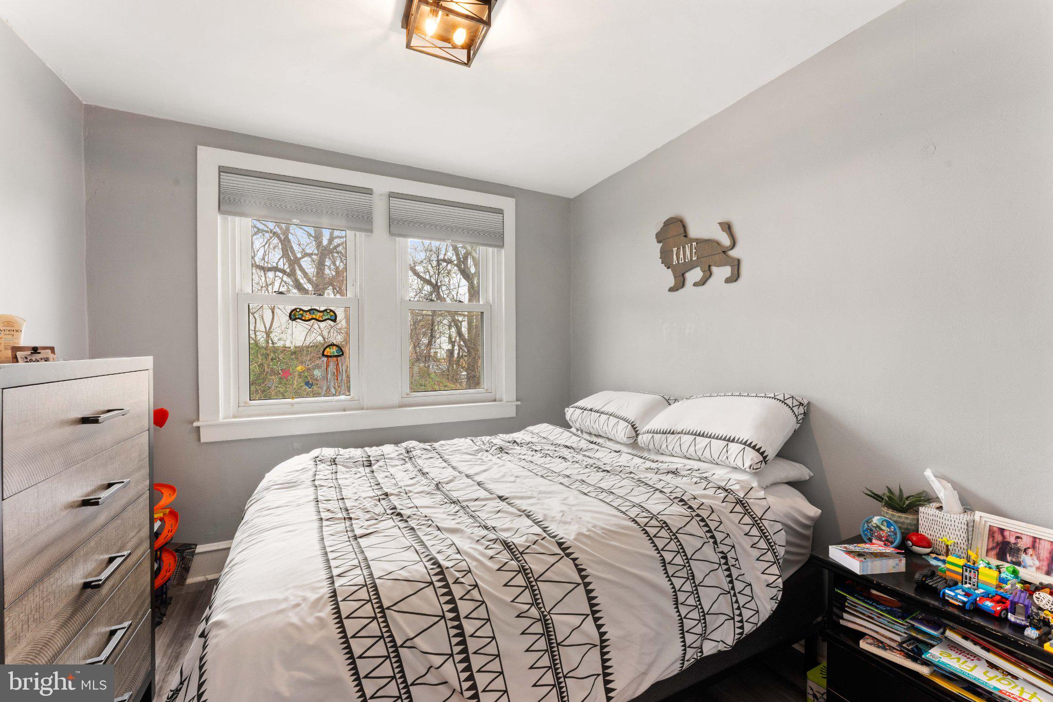 4823 Tibben Street Philadelphia, PA 19128 - Photo 18 of 28 a bedroom with a bed and a window
