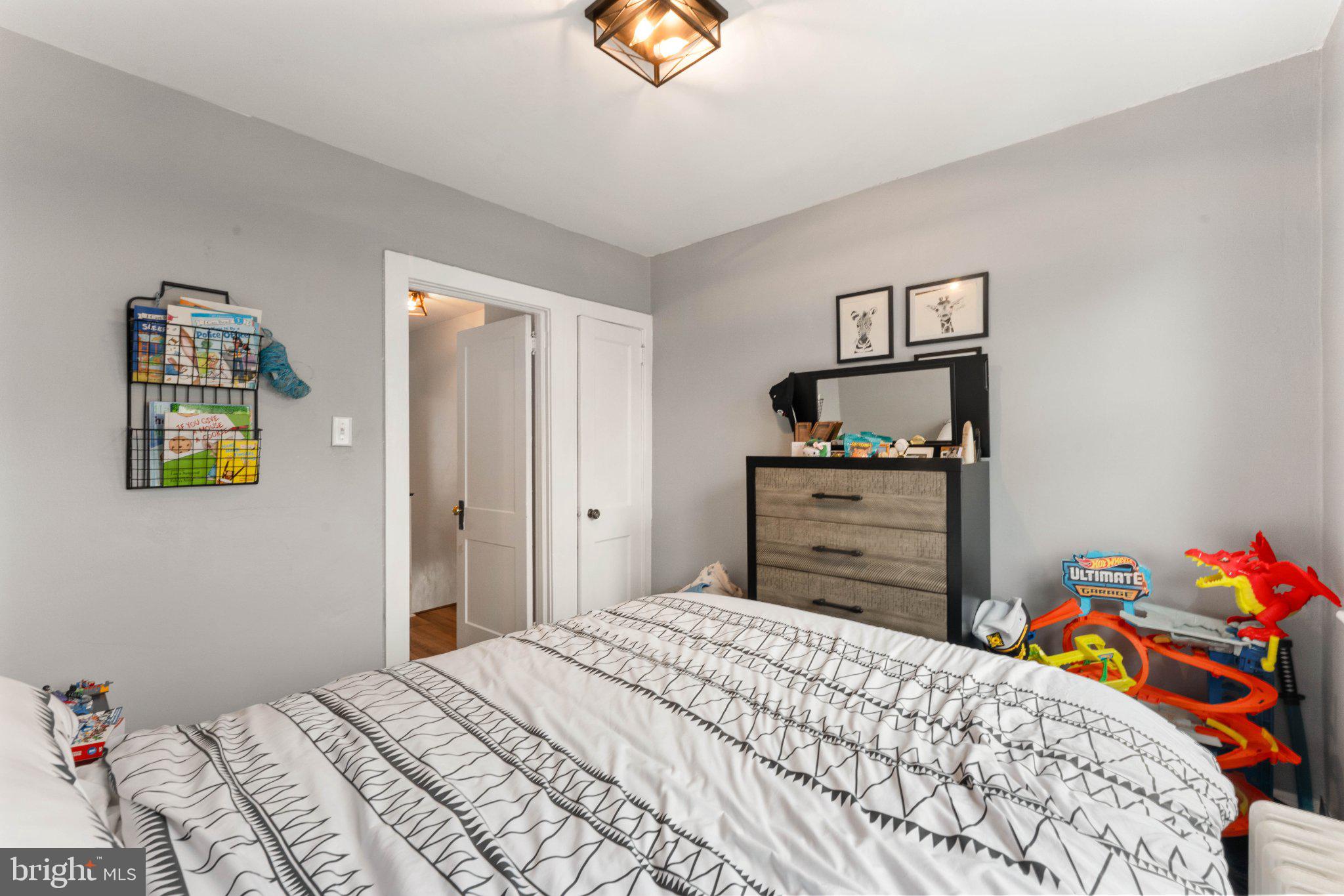 4823 Tibben Street Philadelphia, PA 19128 - Photo 19 of 28 a bedroom with a bed and a closet