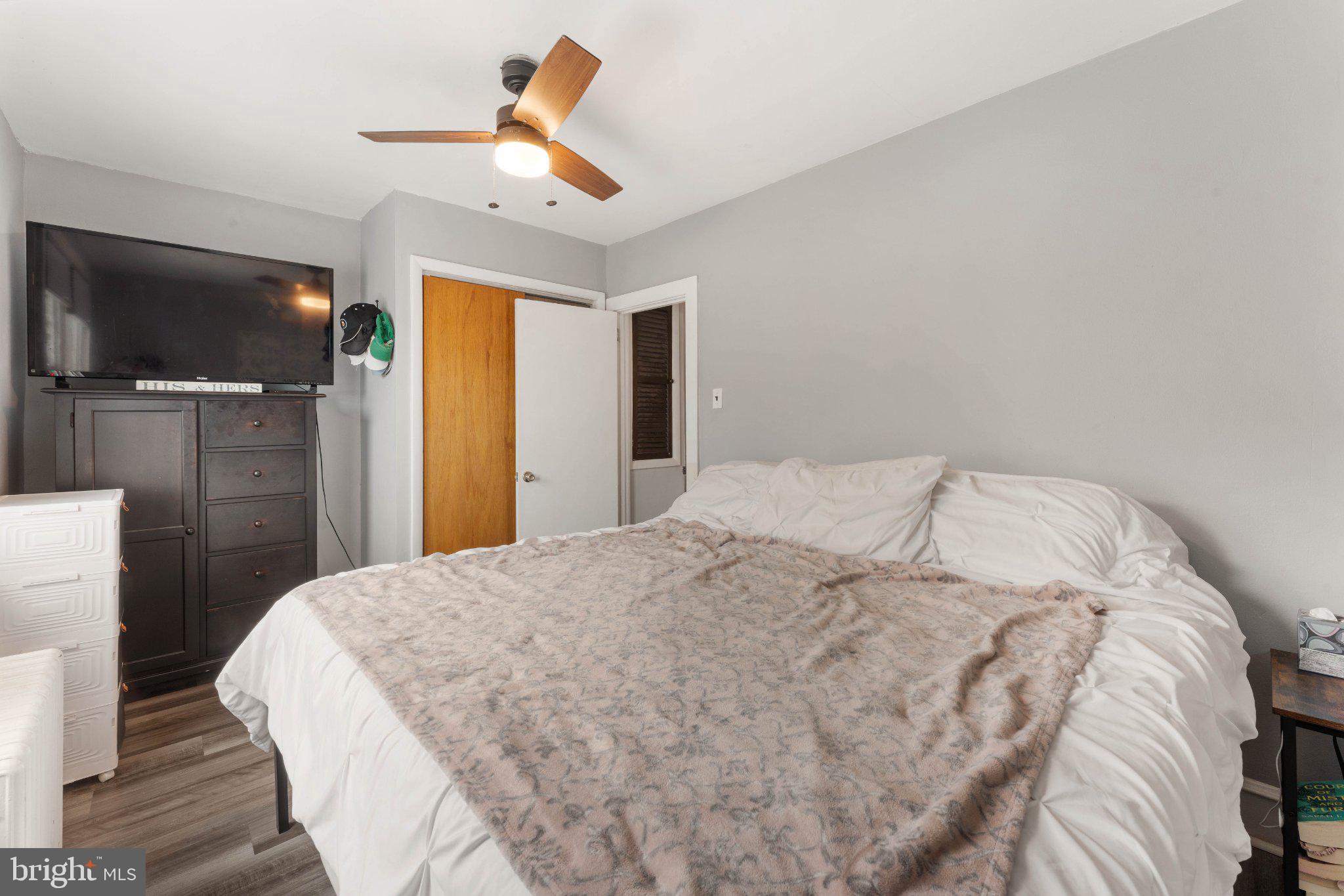 4823 Tibben Street Philadelphia, PA 19128 - Photo 25 of 28 a large bed in a bedroom next to a window