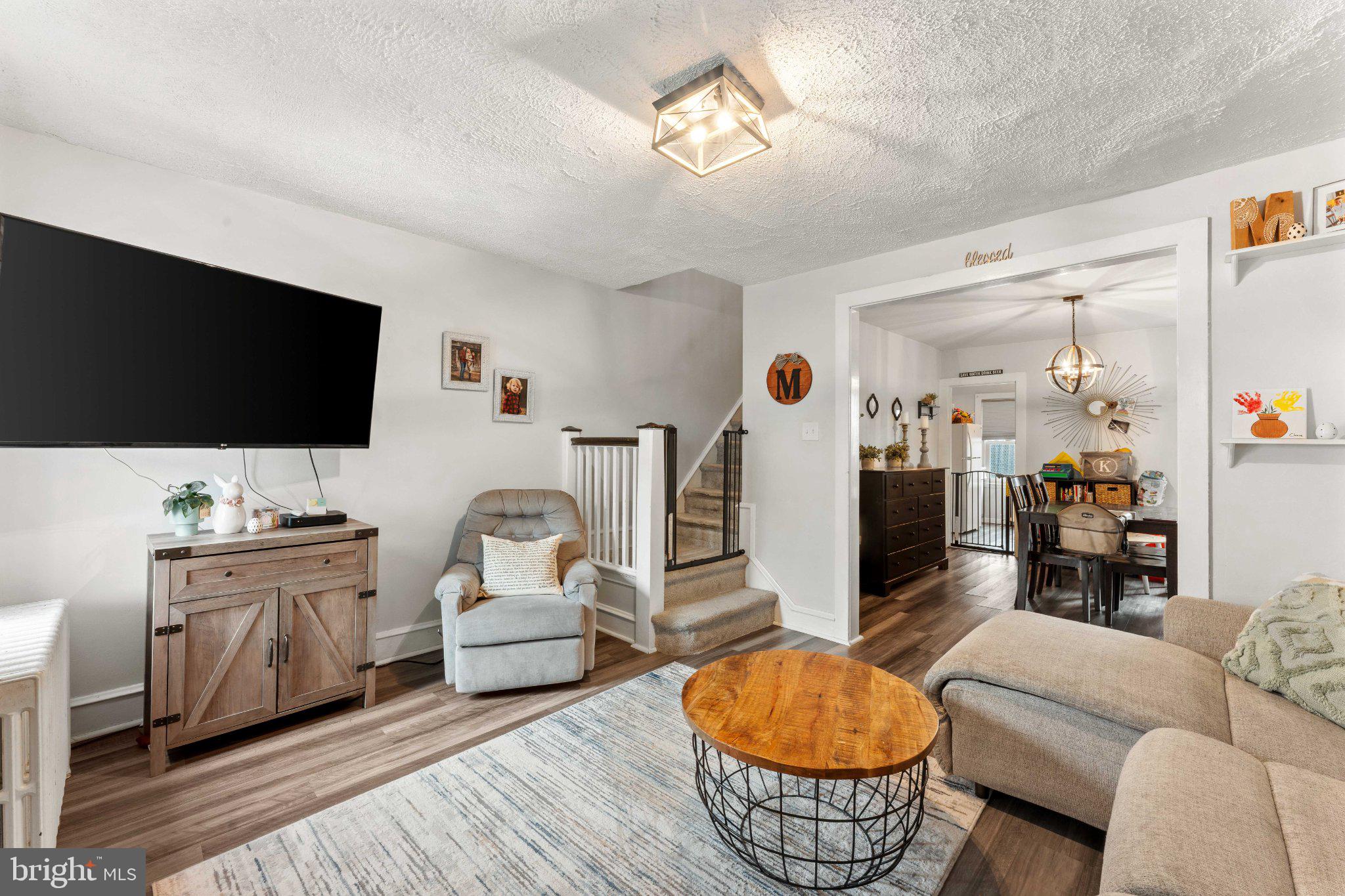4823 Tibben Street Philadelphia, PA 19128 - Photo 6 of 28 a living room with furniture and a flat screen tv
