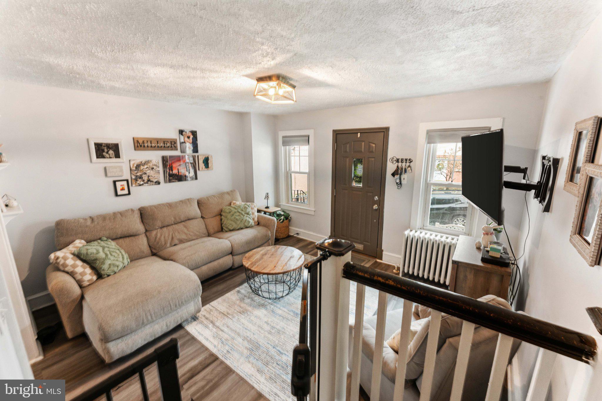 4823 Tibben Street Philadelphia, PA 19128 - Photo 8 of 28 a living room with furniture and wooden floor