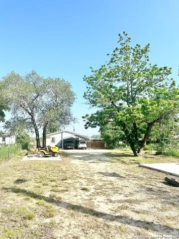a view of a swimming pool with an outdoor space and seating area