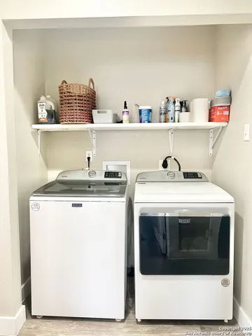 a utility room with washer and dryer