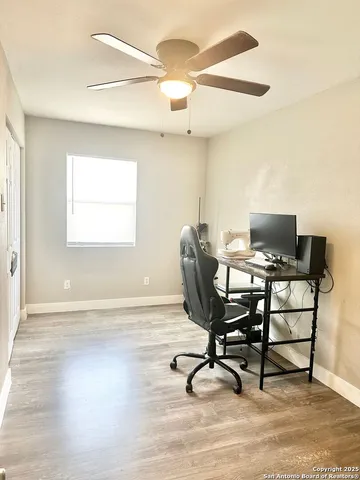 a workspace with furniture and a window