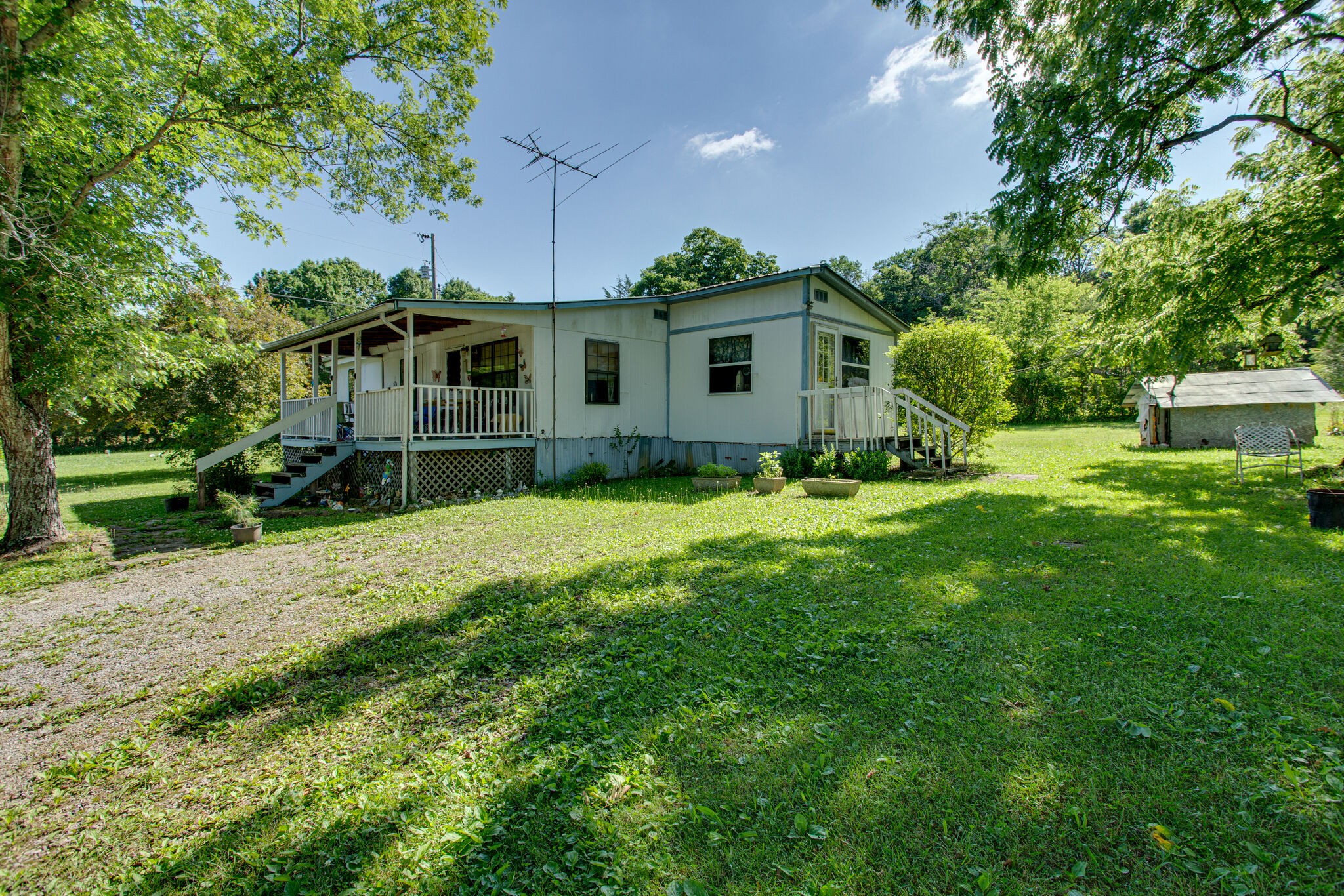 2837 South Commerce Road Watertown, TN 37184 - Photo 2 of 9 a front view of a house with garden