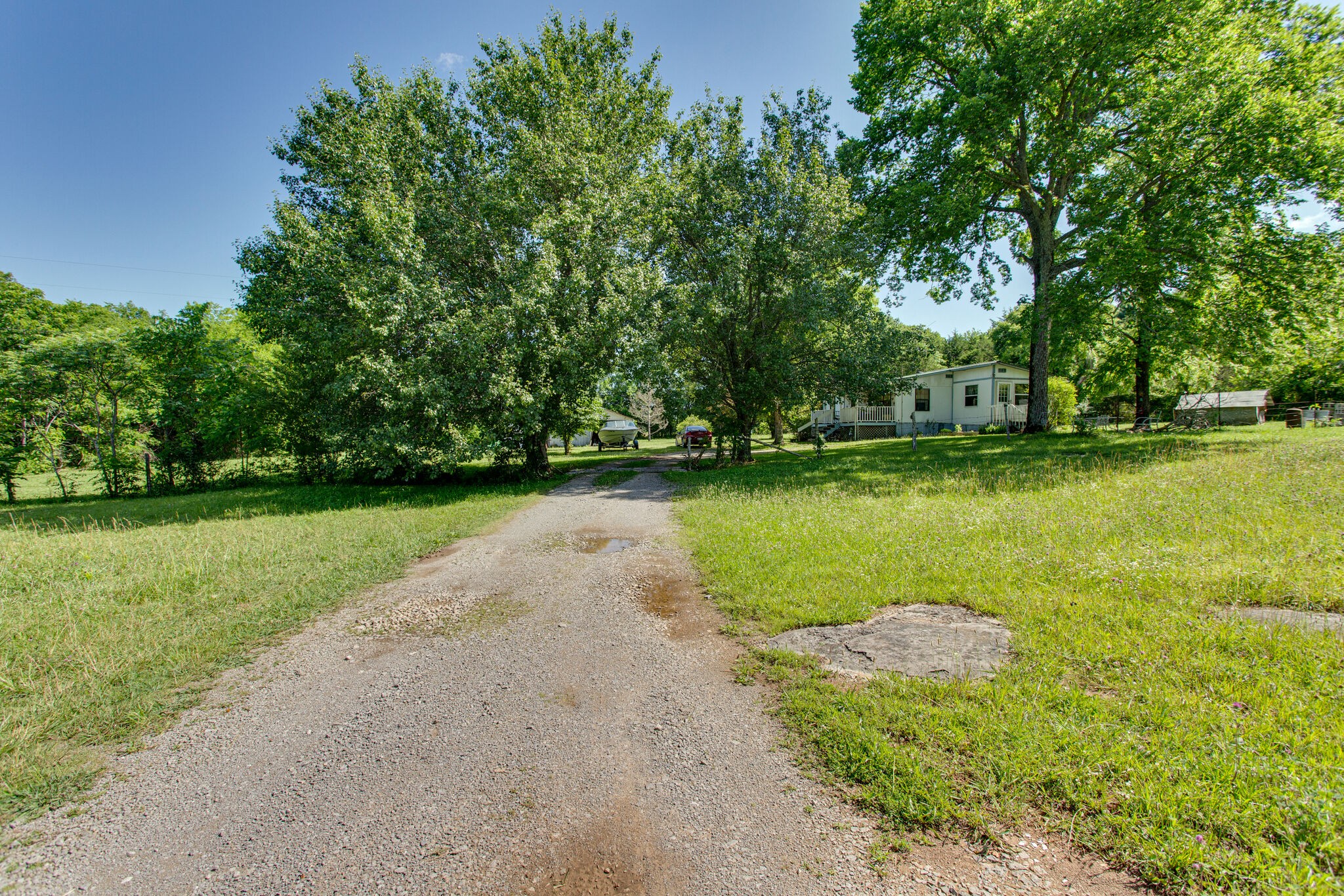 2837 South Commerce Road Watertown, TN 37184 - Photo 6 of 9 a view of a lake with a yard