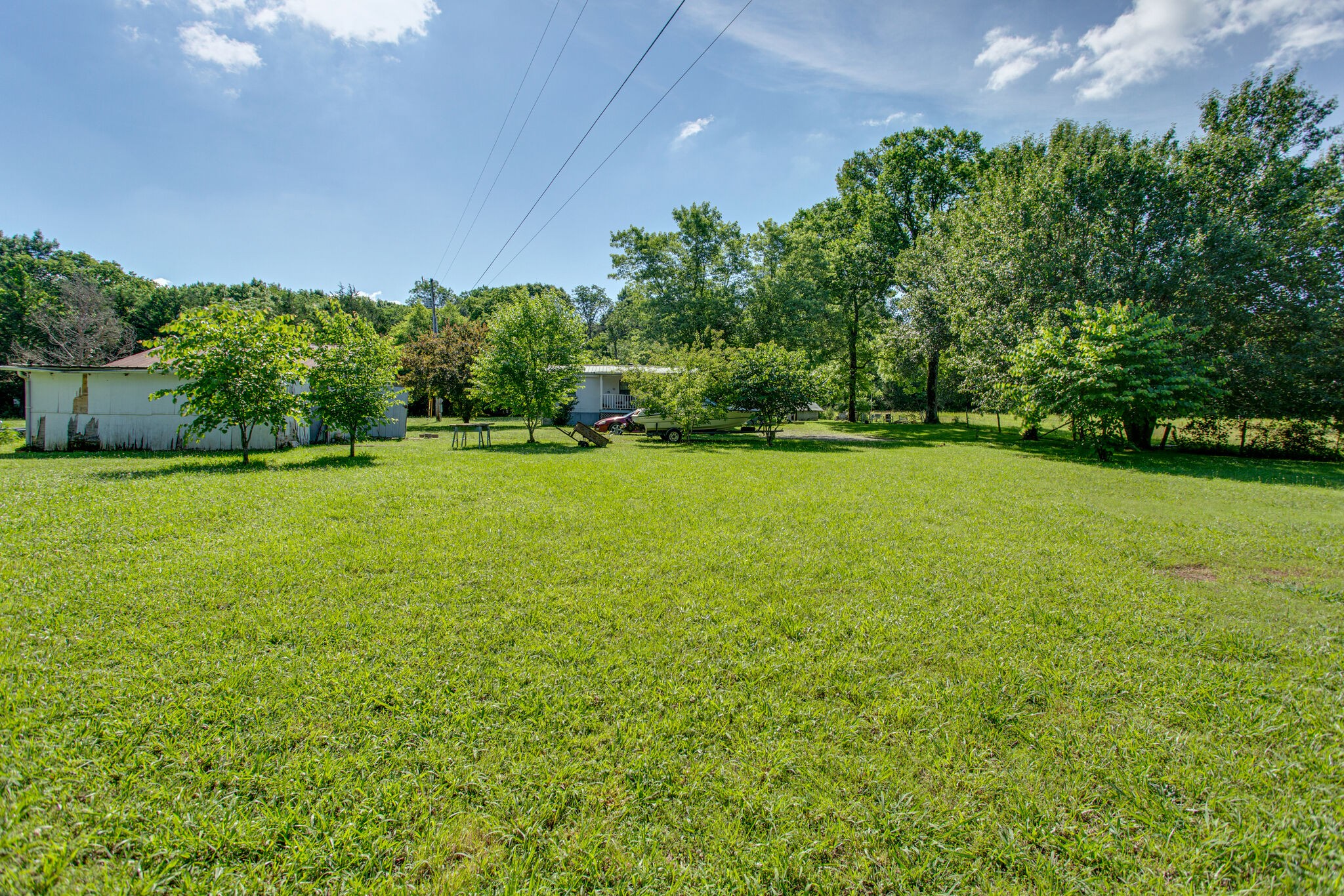 2837 South Commerce Road Watertown, TN 37184 - Photo 7 of 9 a view of a big yard with a house in the background