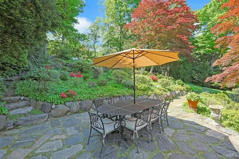 a patio with a patio table and chairs
