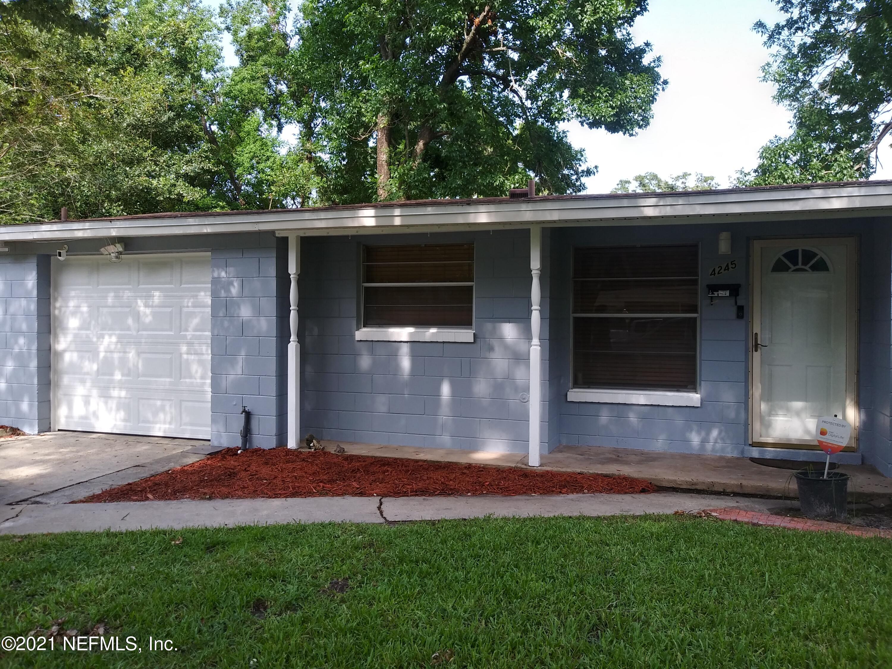 4245 Springwood Road Jacksonville, FL 32207 - Photo 1 of 12 a front view of a house with a yard