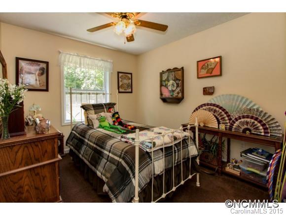 978 Cove Road Rutherfordton, NC 28139 - Photo 13 of 24 a bedroom with furniture and a window