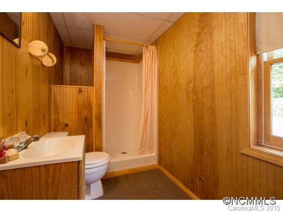 978 Cove Road Rutherfordton, NC 28139 - Photo 18 of 24 a bathroom with a sink a toilet and shower